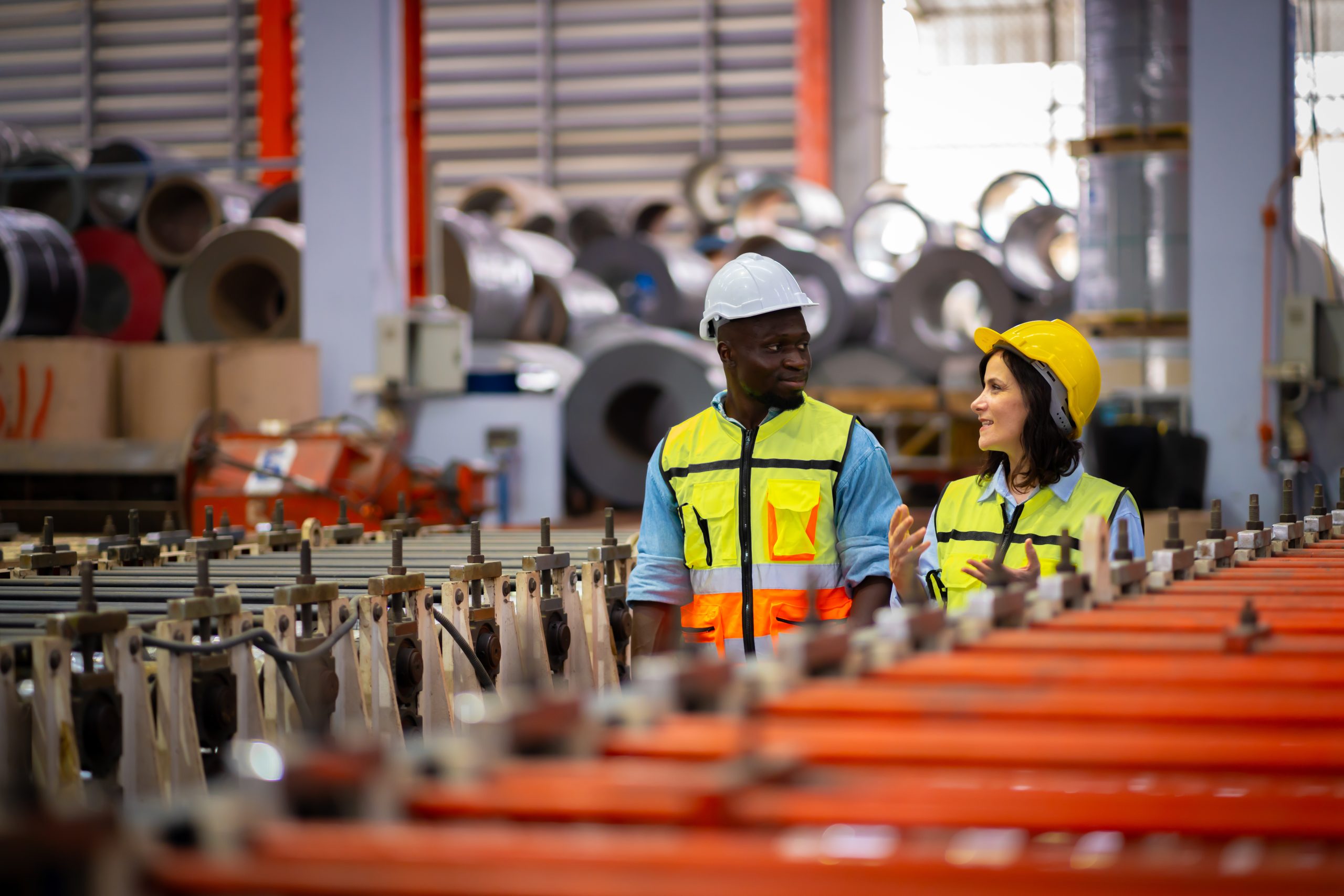 team-male-and-female-engineers-in-a-metal-sheet